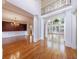 Bright open space boasts hardwood floors, columns, large windows, and custom trim work at 2883 Thurleston Ln, Duluth, GA 30097