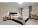 Serene main bedroom with neutral tones, a comfortable king bed, and decorative pillows at 2883 Thurleston Ln, Duluth, GA 30097