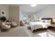 Bright main bedroom with sitting area, plush carpets, and warm, inviting decor at 2883 Thurleston Ln, Duluth, GA 30097