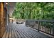 Large wooden deck with railings, perfect for outdoor entertaining at 3390 Kenland Se Rd, Smyrna, GA 30082
