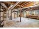 Spacious unfinished basement area with exposed beams and concrete flooring at 3390 Kenland Se Rd, Smyrna, GA 30082