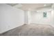 Finished basement area featuring carpeting, white walls and plenty of room at 3390 Kenland Se Rd, Smyrna, GA 30082
