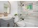 Tastefully designed bathroom with updated fixtures, shower-tub combo, and decorative mirror at 3390 Kenland Se Rd, Smyrna, GA 30082
