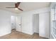 Neat and organized bedroom featuring a closet, natural light and clean floors at 3390 Kenland Se Rd, Smyrna, GA 30082