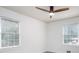 Clean, well-lit bedroom with two windows and modern ceiling fan at 3390 Kenland Se Rd, Smyrna, GA 30082