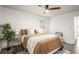 Inviting bedroom with a ceiling fan, hardwood floors, and lots of natural light at 3390 Kenland Se Rd, Smyrna, GA 30082
