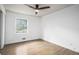 Spacious bedroom features hardwood floors, window, and natural light at 3390 Kenland Se Rd, Smyrna, GA 30082