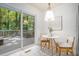 Cozy breakfast nook with views of a large deck and wooded backyard at 3390 Kenland Se Rd, Smyrna, GA 30082
