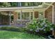 Lovely home with charming front porch detail and lush hydrangea bush at 3390 Kenland Se Rd, Smyrna, GA 30082