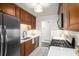 Kitchen featuring a gas range, stainless steel appliances, and custom cabinets at 3390 Kenland Se Rd, Smyrna, GA 30082
