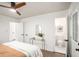 Bedroom with ensuite bathroom access, a ceiling fan and hardwood floors at 3390 Kenland Se Rd, Smyrna, GA 30082