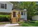 Lovely home exterior featuring a welcoming front entrance with new wooden steps and a cozy front porch at 4030 Tanglewood Rd, Snellville, GA 30039
