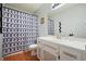 Full bathroom with tub/shower and single sink vanity and modern geometric curtain at 6223 Emerald Springs Se Dr, Acworth, GA 30102
