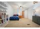 Bright bedroom with bed, closet and shelving for books and toys at 6223 Emerald Springs Se Dr, Acworth, GA 30102