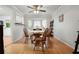 Inviting dining room features a bay window and classic wooden furniture at 6223 Emerald Springs Se Dr, Acworth, GA 30102