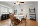 Charming dining room with classic furniture, wooden floor and ample natural light at 6223 Emerald Springs Se Dr, Acworth, GA 30102