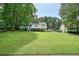 Inviting home with a well-manicured lawn and lush greenery, offering a serene and picturesque setting at 6223 Emerald Springs Se Dr, Acworth, GA 30102