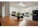 Cozy kitchen features a breakfast bar and white cabinetry and black appliances at 6223 Emerald Springs Se Dr, Acworth, GA 30102