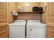 Laundry room with front loading washer and dryer at 6223 Emerald Springs Se Dr, Acworth, GA 30102