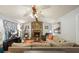 Spacious living room featuring a stone fireplace, wood accents, and cozy seating arrangement at 6223 Emerald Springs Se Dr, Acworth, GA 30102
