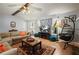 Comfortable living room with wood-look floors, stone fireplace, and stylish decor at 6223 Emerald Springs Se Dr, Acworth, GA 30102