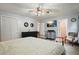 Spacious main bedroom featuring a comfortable bed, furniture, and TV at 6223 Emerald Springs Se Dr, Acworth, GA 30102