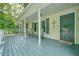 Covered porch with rocking chairs and cheerful decor create an inviting outdoor space for relaxing at 6223 Emerald Springs Se Dr, Acworth, GA 30102