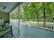 Open-air porch with view of the neighborhood offers a serene setting for outdoor relaxation and enjoyment at 6223 Emerald Springs Se Dr, Acworth, GA 30102