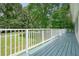 Spacious porch with white railing offering an open view of the neighborhood and a tranquil outdoor setting at 6223 Emerald Springs Se Dr, Acworth, GA 30102