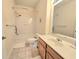 Bright bathroom features a shower-tub combo, tiled floor, and modern vanity at 1975 Nocturne Dr # 2206, Alpharetta, GA 30009