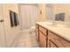 Bright bathroom featuring tile floors and a wood vanity at 1975 Nocturne Dr # 2206, Alpharetta, GA 30009