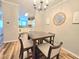 Open dining area featuring a square wood table with access to kitchen at 1975 Nocturne Dr # 2206, Alpharetta, GA 30009