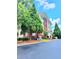 Multi-story building with brick and siding exterior and well-maintained landscaping at 1975 Nocturne Dr # 2206, Alpharetta, GA 30009