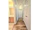 Hallway view with linen closet and a bathroom with oak cabinetry at 1975 Nocturne Dr # 2206, Alpharetta, GA 30009