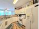 Bright, white kitchen featuring modern appliances and counter space, offering a functional cooking space at 1975 Nocturne Dr # 2206, Alpharetta, GA 30009