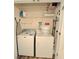 Convenient laundry room with washer, dryer, and shelving for storage at 1975 Nocturne Dr # 2206, Alpharetta, GA 30009