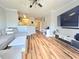 Bright open-concept living area features modern furniture and wood flooring at 1975 Nocturne Dr # 2206, Alpharetta, GA 30009