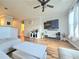 This open-concept living area features a large tv and hardwood flooring at 1975 Nocturne Dr # 2206, Alpharetta, GA 30009
