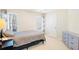 Well-lit bedroom features neutral walls, ceiling fan, and side table with a lamp at 380 Victorian Ln, Duluth, GA 30097