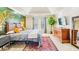 The primary bedroom has a leaf paint mural with vaulted ceiling and ensuite bathroom at 380 Victorian Ln, Duluth, GA 30097