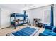 bedroom featuring a bunk bed, a sofa, a football rug, and great natural light at 380 Victorian Ln, Duluth, GA 30097