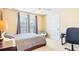 This bedroom features a desk area with natural light from the windows at 380 Victorian Ln, Duluth, GA 30097