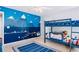 This blue themed room has a bunk bed and an mountain paint mural at 380 Victorian Ln, Duluth, GA 30097