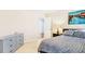 This bedroom features a dresser with art above the bed, and an ensuite bathroom at 380 Victorian Ln, Duluth, GA 30097