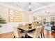 Elegant dining room featuring a modern chandelier, hardwood floors and decorative wall art at 380 Victorian Ln, Duluth, GA 30097