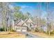 Charming two-story home with a three-car garage and stone detailing on the exterior at 380 Victorian Ln, Duluth, GA 30097