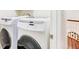 Laundry area features matching front-load washer and dryer at 380 Victorian Ln, Duluth, GA 30097