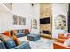 Spacious living room with stone fireplace, hardwood floors, and modern decor at 380 Victorian Ln, Duluth, GA 30097