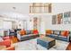 Open concept living area featuring hardwood floors, a large rug, and lots of seating at 380 Victorian Ln, Duluth, GA 30097