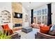 Cozy living room with stone fireplace, built-in shelving, and comfortable seating at 380 Victorian Ln, Duluth, GA 30097